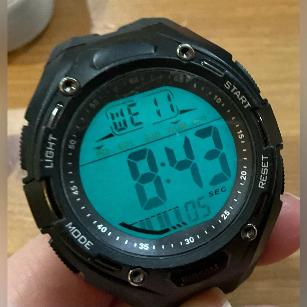 Brigadeon: BTW1801/ 5ATM Men’s black digital adjustable plastic wrist watch.